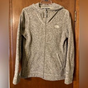 The North Face Fleece full zip Oatmeal colored sweater with hood.